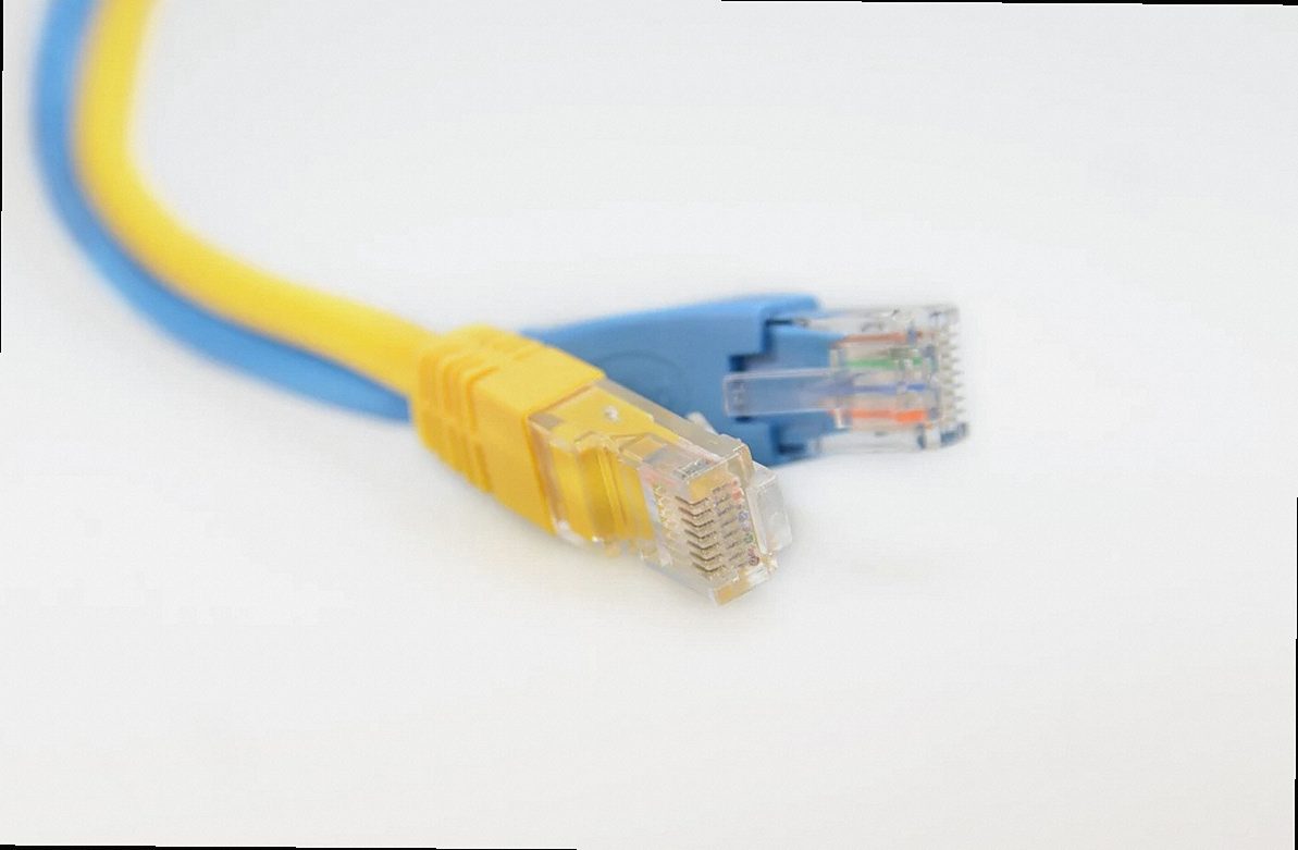 A yellow network patch cable and its RJ45 connector