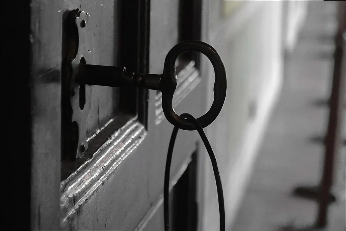 An old iron lock and bolt on a weathered door