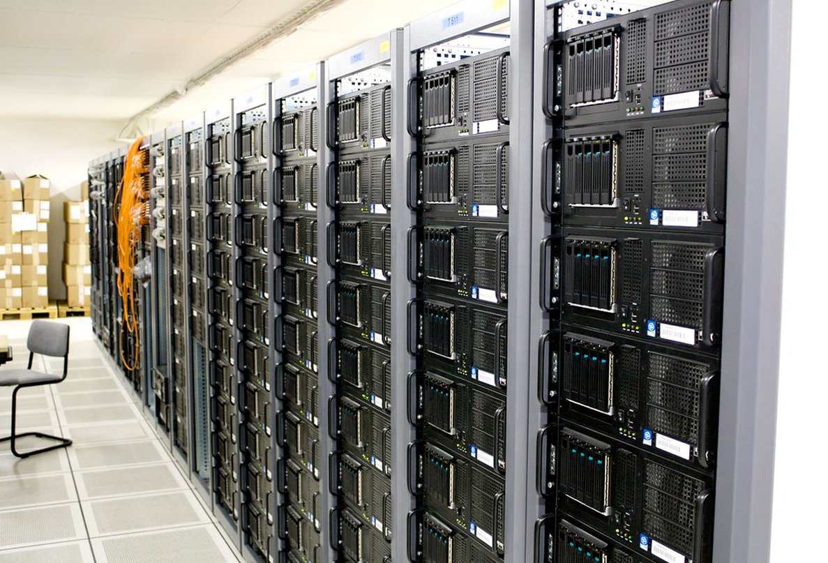Rows of server racks along a machine-room aisle